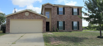 Killeen house for rent - a brick house with a white garage door