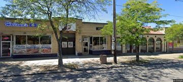 Cleveland apartment for rent - the front of a building with a bar and trees