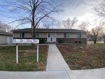Kearney apartment for rent - the front of a house with mailboxes on the sidewalk