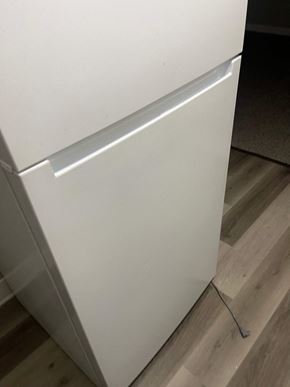 Akron apartment for rent - A white refrigerator with a handle on the door.