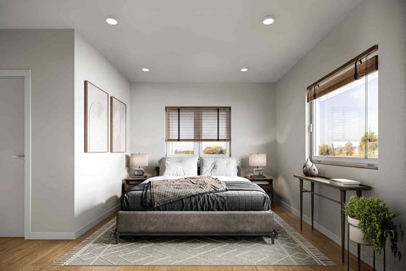 Erie apartment for rent - A bedroom with a large bed and a window with blinds.