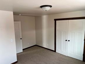 Bozeman house for rent - a bedroom with two closets and a ceiling light