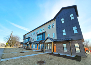 Indianapolis apartment for rent - A modern two-story building with a blue exterior and a red door.