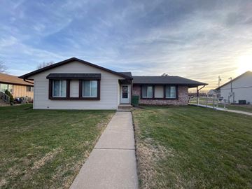 Kearney apartment for rent - a small white house with a sidewalk in front of it