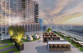 Long Island City apartment for rent - a rendering of the rooftop terrace of a building with tables and chairs