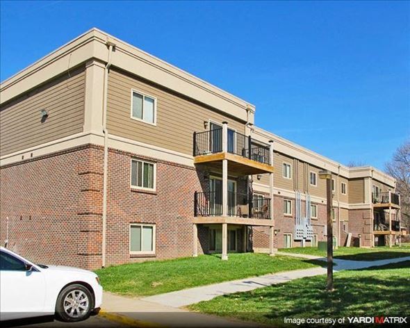 Lincoln apartment for rent - a white car parked in front of an apartment building