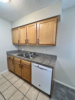 Lincoln apartment for rent - an empty kitchen with a sink and a dishwasher