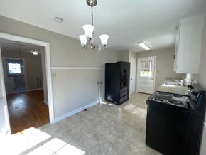 Raleigh house for rent - a kitchen and living room with a stove and a refrigerator