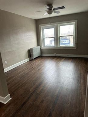 Cleveland Heights apartment for rent - an empty room with a ceiling fan and a window