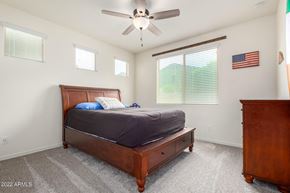 Buckeye house for rent - a bedroom with a bed and a ceiling fan