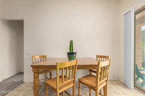 Buckeye house for rent - a dining room table with chairs and a potted plant