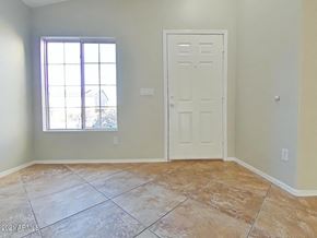 Buckeye house for rent - an empty room with a door and a window