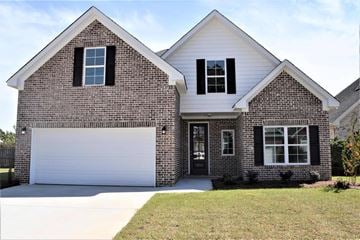 Florence house for rent - A two-story house with a garage door.