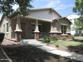 Buckeye house for rent - a house with a front porch and steps
