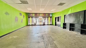 Bay City house for rent - an empty room with green walls and a blackboard