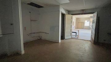 Bay City house for rent - the living room of the house has been empty for years