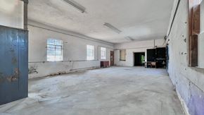 Bay City house for rent - an empty room in an abandoned building with white walls and a concrete floor