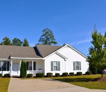 Raleigh apartment for rent - A white house with green shutters and a grey roof.