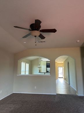 Killeen house for rent - an empty living room with a ceiling fan