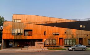 Calgary apartment for rent - A building with a sign that says GROW on it.