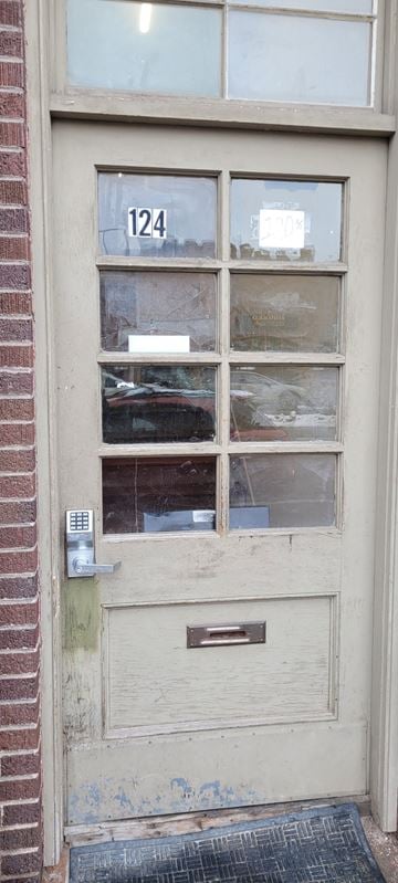 Bozeman apartment for rent - the front door of a building with a number 124 on it