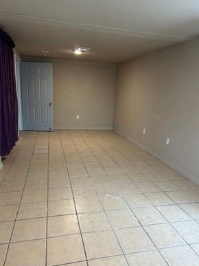 Killeen house for rent - an empty room with a tiled floor and a door