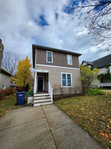 Petoskey house for rent - a small house with a sidewalk in front of it