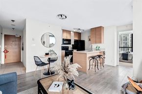 Vancouver apartment for rent - A modern kitchen with a dining table and chairs.
