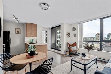 Vancouver apartment for rent - A modern living room with a wooden table and black chairs.