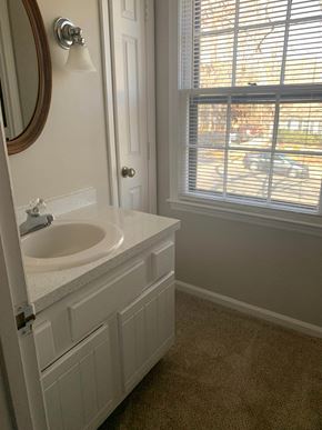 Raleigh house for rent - A bathroom with a sink and a window.