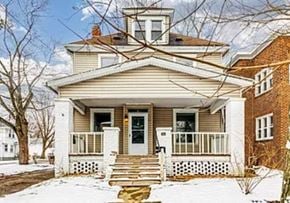 Akron apartment for rent - a house with a wooden bench in the snow