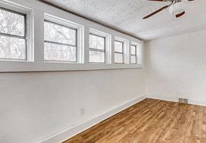Akron apartment for rent - an empty room with a hardwood floor and a window