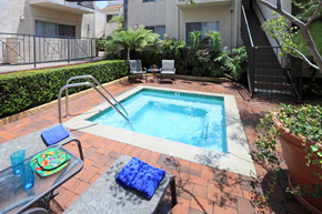 Burbank apartment for rent - a small pool in a backyard with a table and chairs