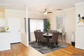 Burbank apartment for rent - a dining room with a table and chairs and a ceiling fan