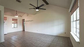 Royse City apartment for rent - A room with a ceiling fan and tile flooring.