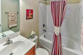 Raleigh apartment for rent - A white sink with a silver faucet in a bathroom.