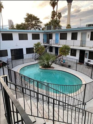 Las Vegas apartment for rent - a large swimming pool in front of a building