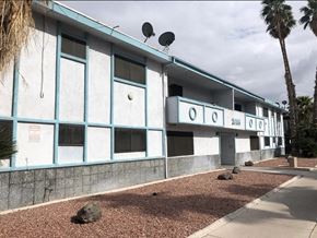 Las Vegas apartment for rent - a blue and white building with two satellites on top of it