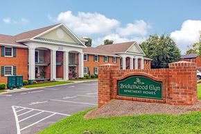 Raleigh apartment for rent - The image shows a building with a sign that reads "Brickwood Glen Apartment Homes.".