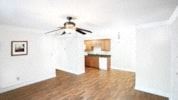 Raleigh apartment for rent - an empty living room with a ceiling fan