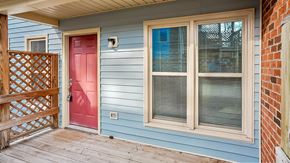 Raleigh apartment for rent - a blue house with a red door and a porch