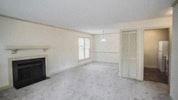 Raleigh apartment for rent - an empty living room with a fireplace