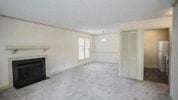 Raleigh apartment for rent - an empty living room with a fireplace