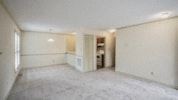 Raleigh apartment for rent - an empty living room and kitchen with no furniture