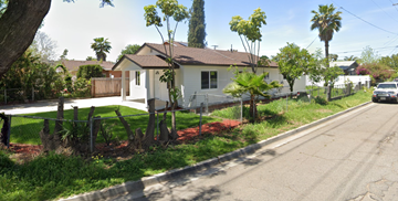 Escondido house for rent - a house with a fence and a street in front of it
