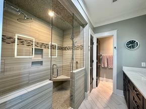 Greenville house for rent - a large bathroom with a shower and a sink in it