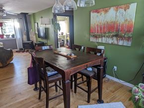 Pagosa Springs house for rent - a dining room table with chairs and a painting on the wall