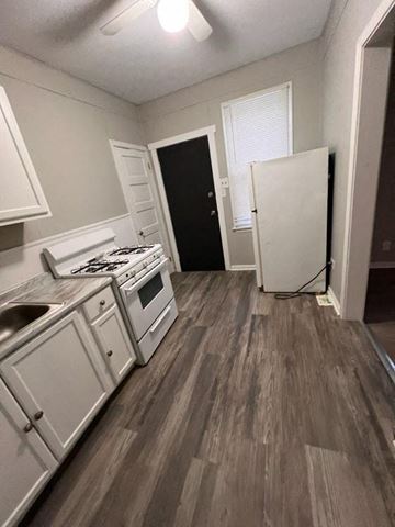 Cleveland apartment for rent - a kitchen with a stove and a refrigerator