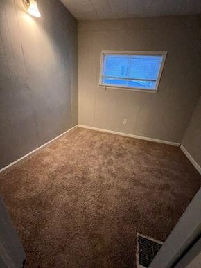 Cleveland apartment for rent - an empty room with a window and a carpet