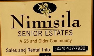 Green apartment for rent - a sign that says senior estates sales and older community